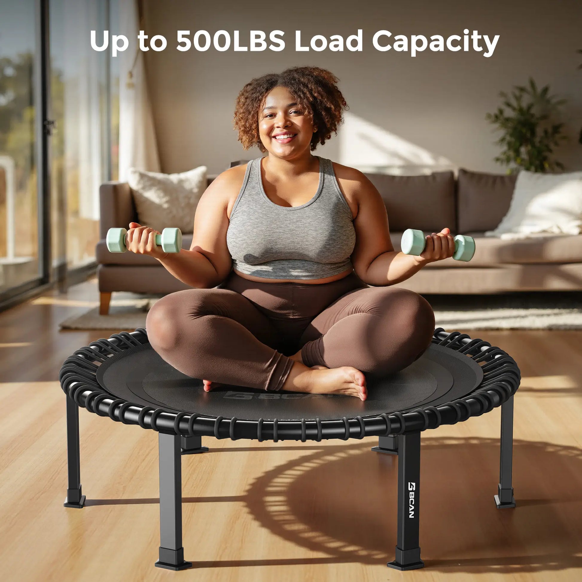 Woman exercising on a fitness trampoline with dumbbells in a living room.