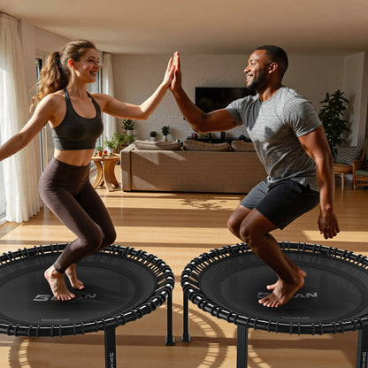 Two people on rebounders in a living room setting